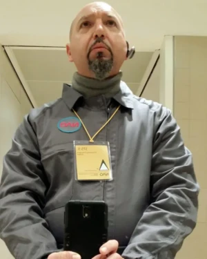 Colin Morgan selfie characterized with work uniform and accreditation - On-set photo.