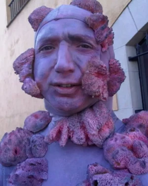 Colin Morgan characterized an STI, pursuing half the population, with purple sea creature prosthetic makeup for a french healthcare commercial.